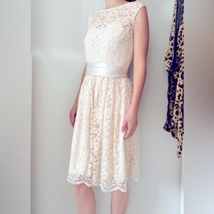 Size 2 Beige lace dress. Only worn once for a bridesmaids dress.